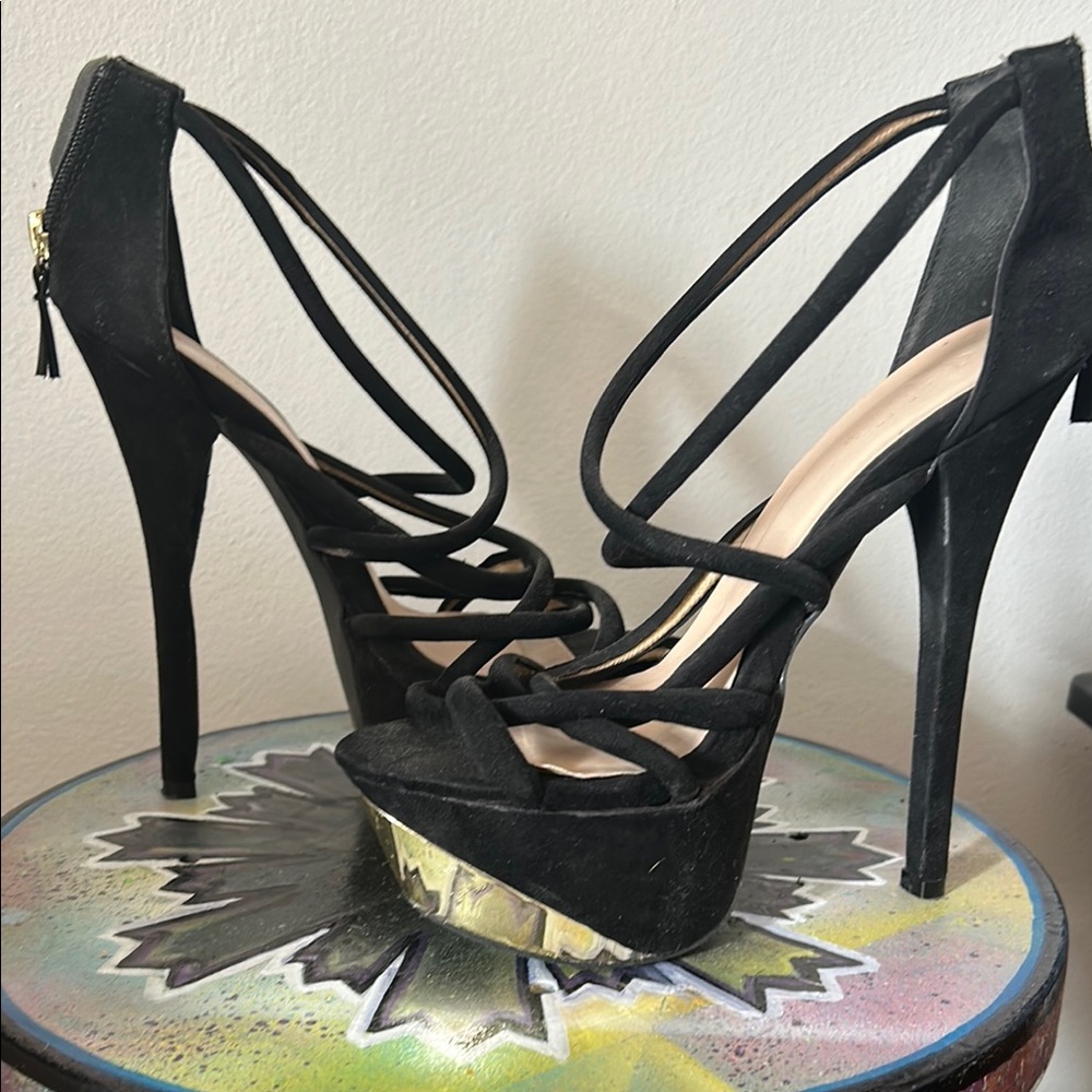 Elegant Black Heels with Strappy Design and Tall Stiletto